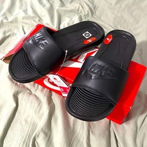 black nike slides in box